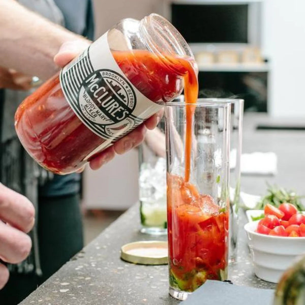 mcclure's bloody mary being poured into a glass