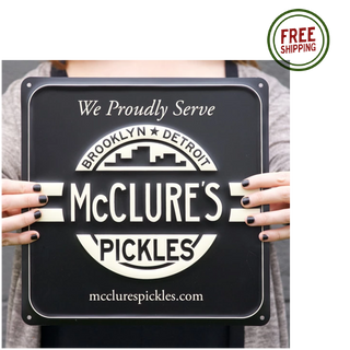 we proudly serve mcclure's pickles here metal sign